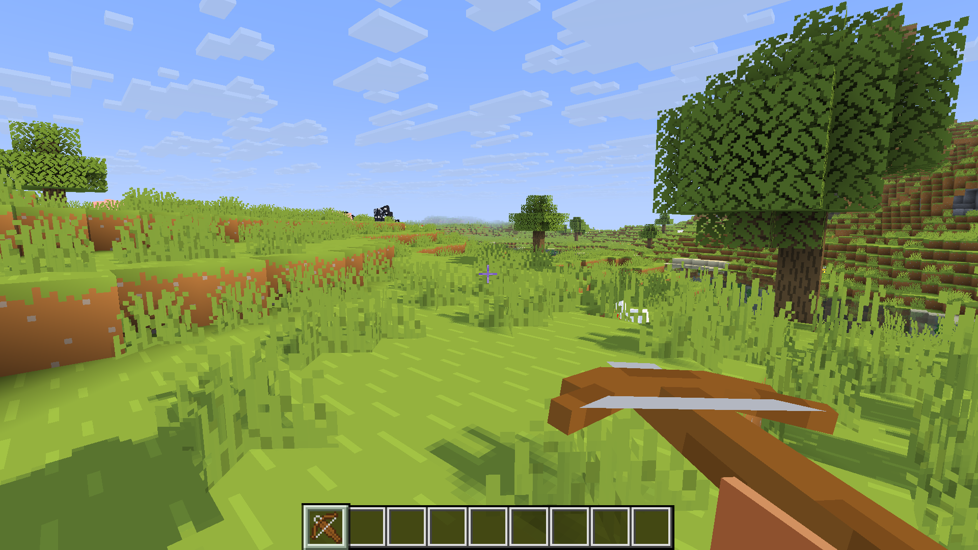 Player holding an empty 3D crossbow in a plains biome
