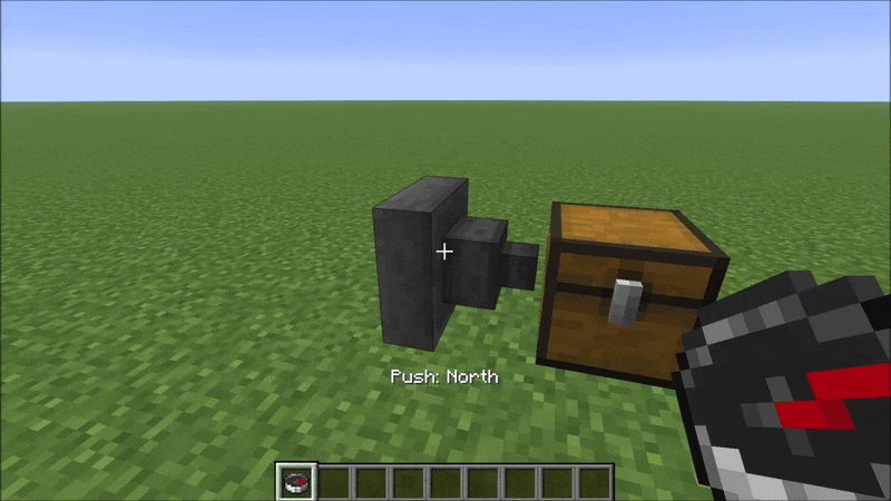 A player holds a compass and repeatedly left-clicks a hopper sitting on the ground. After each click, the spout rotates to a different face — cycling through North, East, South, West, and Up. A message appears in the action bar reading "Push: North", "Push: East", and so on. The hopper block does not break; only its orientation changes.