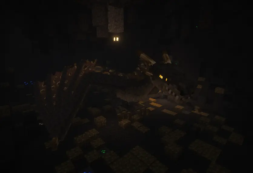 A dragon with gray back and golden belly inside its den while surrounded by gold in the dark