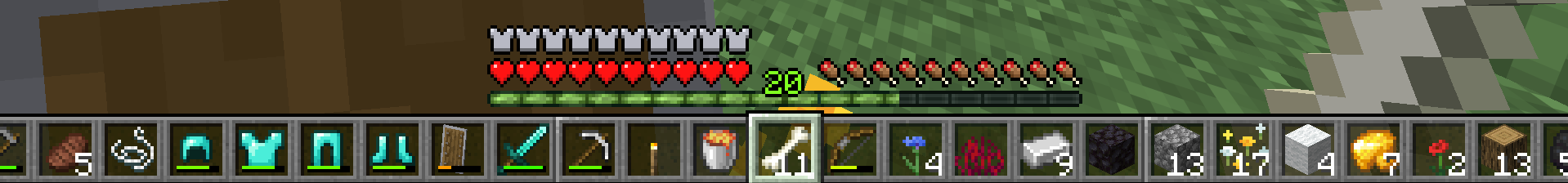 Minecraft gameplay showing an extra-wide hotbar stretching across the bottom of the screen, filled with many items including food, string, diamond armor, a shield, tools, a torch, a bone, flowers, and blocks. Above it are the armor, health, hunger, and XP bars, with the player at level 20.
