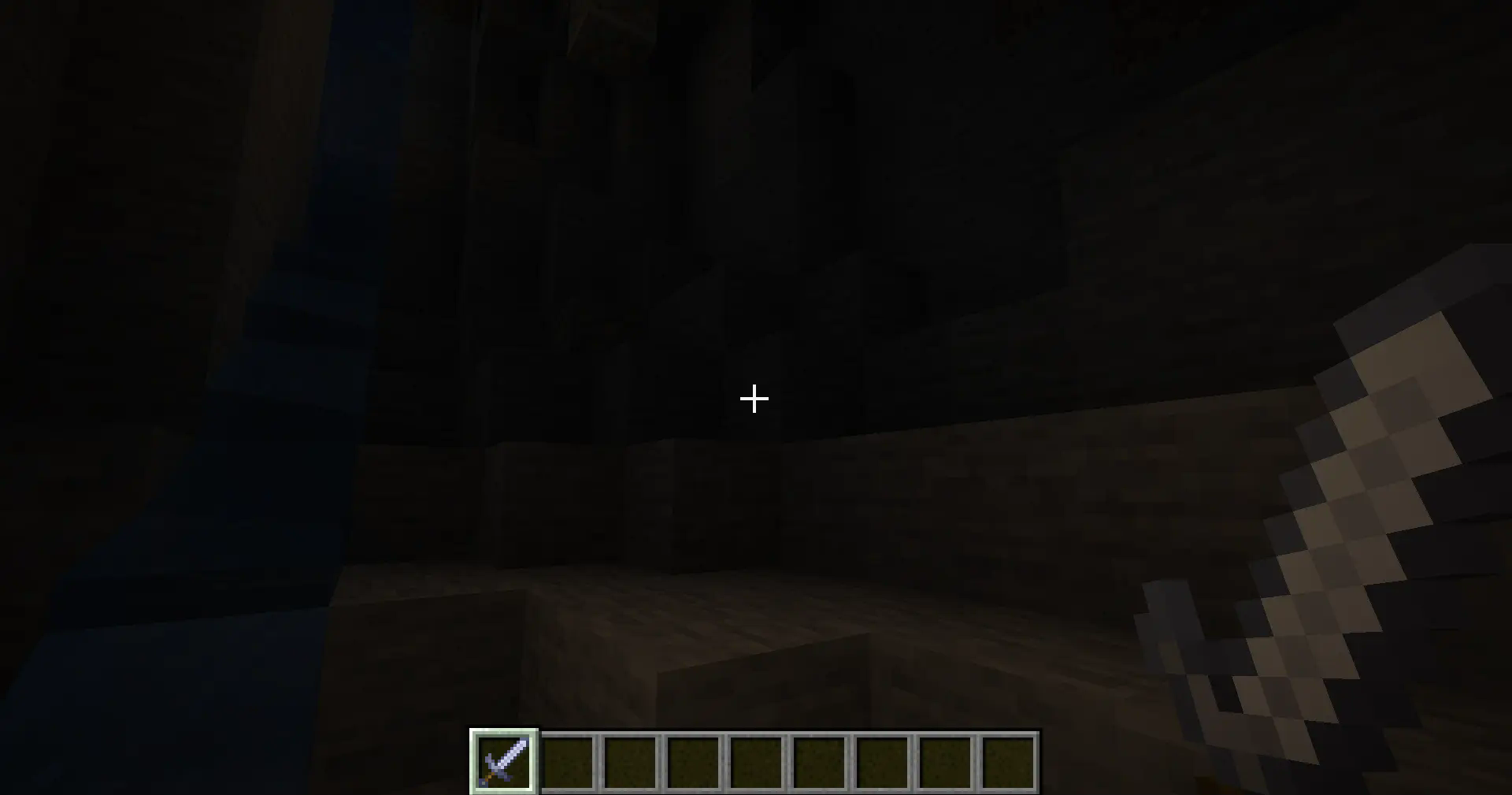 Cave environment in minecraft with a player holding a glimmerstone sword, it emits light into the surrounding area