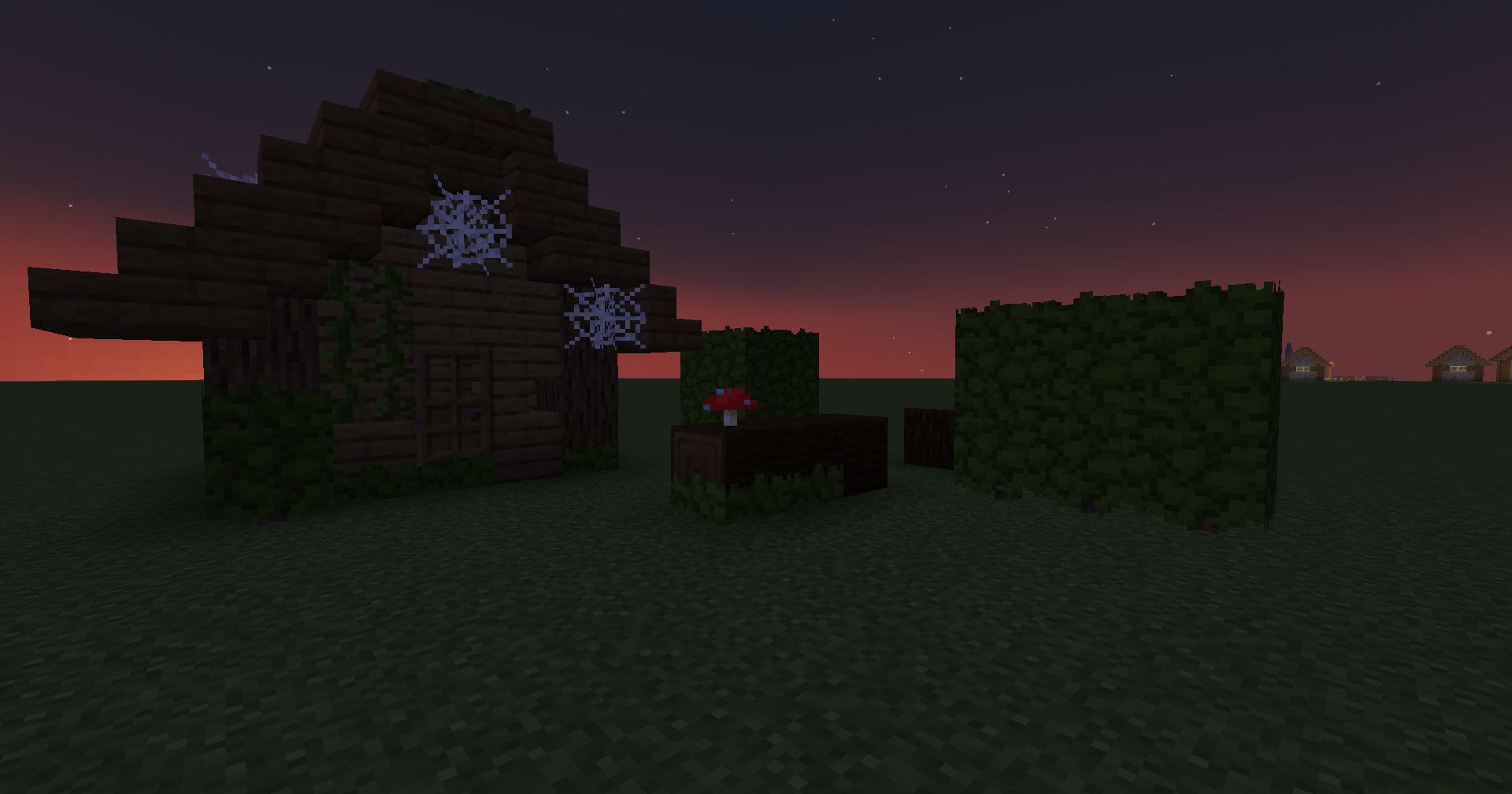 In-game Screenshot of a House and Hedges