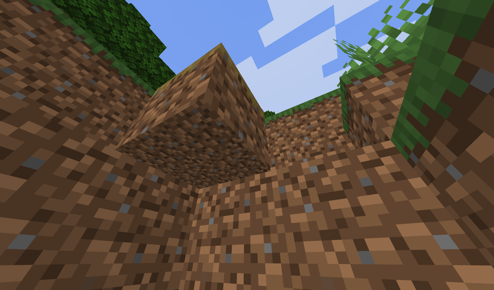 A low-angle first-person view of a Dirt Dirt Path block from inside a small vanila dirt pit. The path block extends across the upper center of the image, showing its lowered profile and brown, 32x32 resolution dirt texture. Vanila dirt blocks form the walls around the viewer, while green grass, vanila trees, a bright blue sky, and large white Minecraft clouds are visible through the opening above. The unusual upward perspective emphasizes the path block’s texture and its placement at ground level. No player interface is shown.