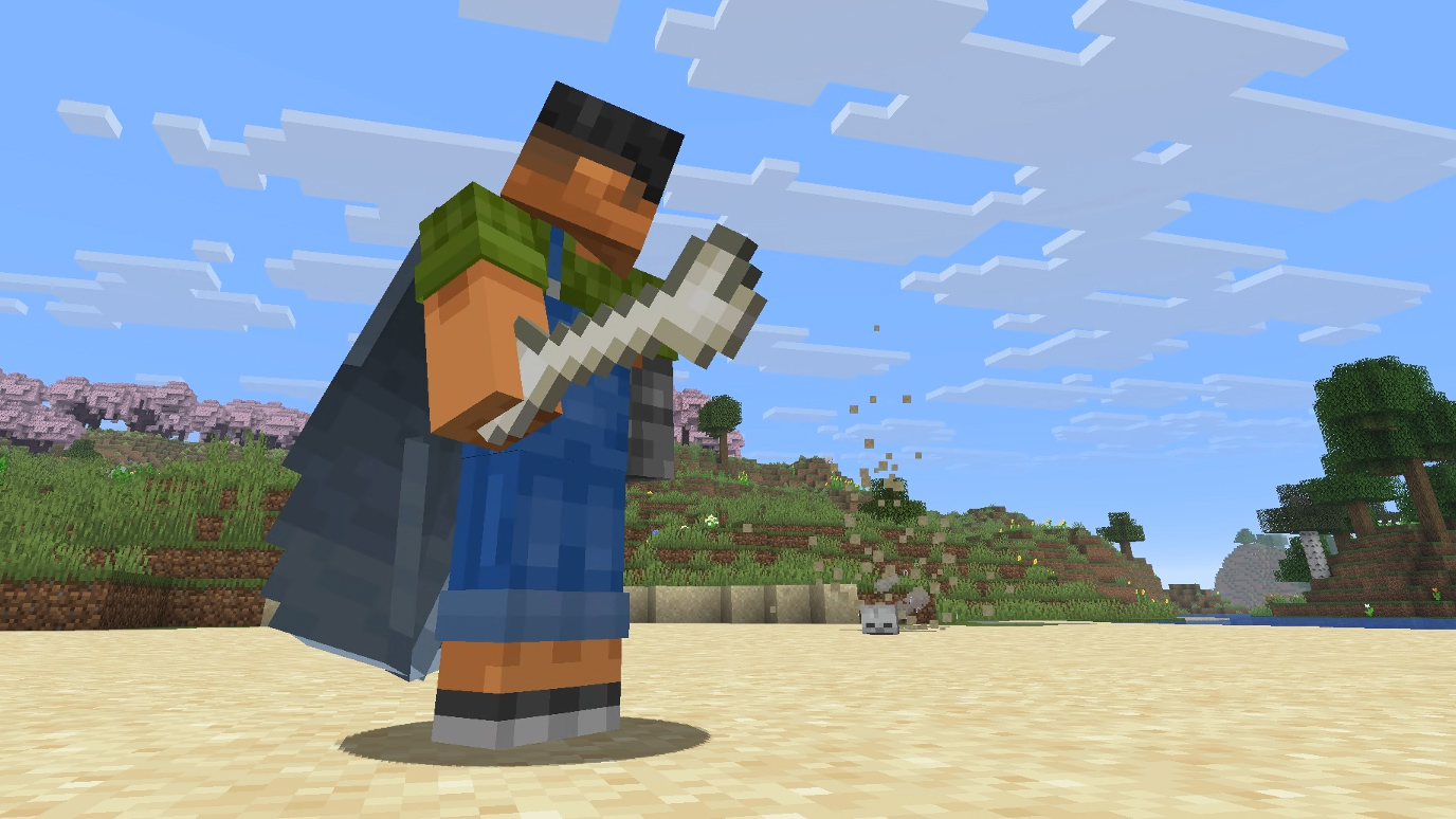 A player stands on a beach holding a bone and turning around in preparation for combat with a charging Beach Yeeter