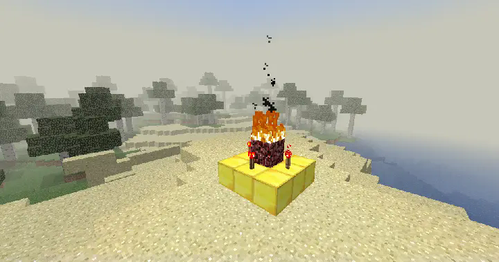 A gold shrine with redstone torches and netherrack set ablaze. Built on a beach.