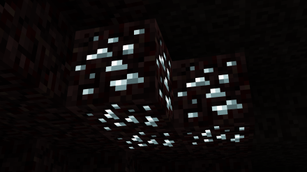 A screenshot of glowing silver ore in the nether