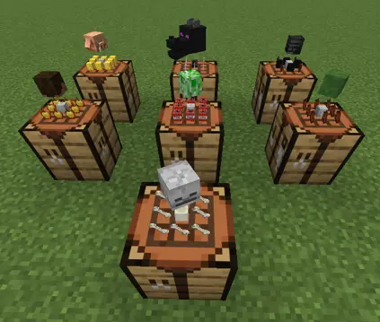 7 crafting tables in a 2x3 pattern with the 7th centered in front, with items placed on top in each block of the crafting table. Floating above those items are mob heads for a piglin, ender dragon, wither skeleton, player head, creeper, zombie, and skeleton.