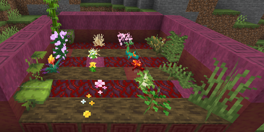 A variety of plants; ferns, saplings, bamboo, flowers, etc. placed on logs and stems.