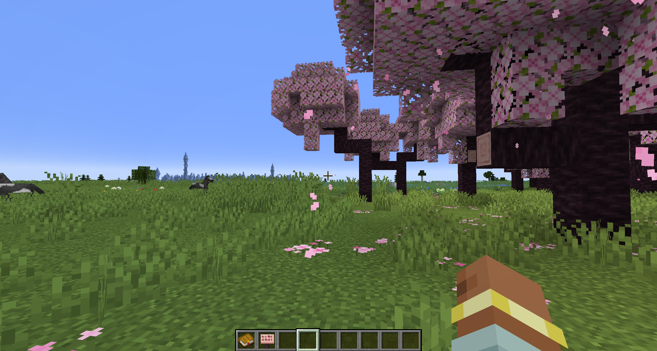 A completely flat world showcasing cherry blossoms, plains and ice spikes in the distance