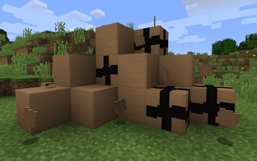 A screenshot of many cardboard boxes on top of eachother, some are taped up and some are not, there are also many pieces of cardboard strewn about