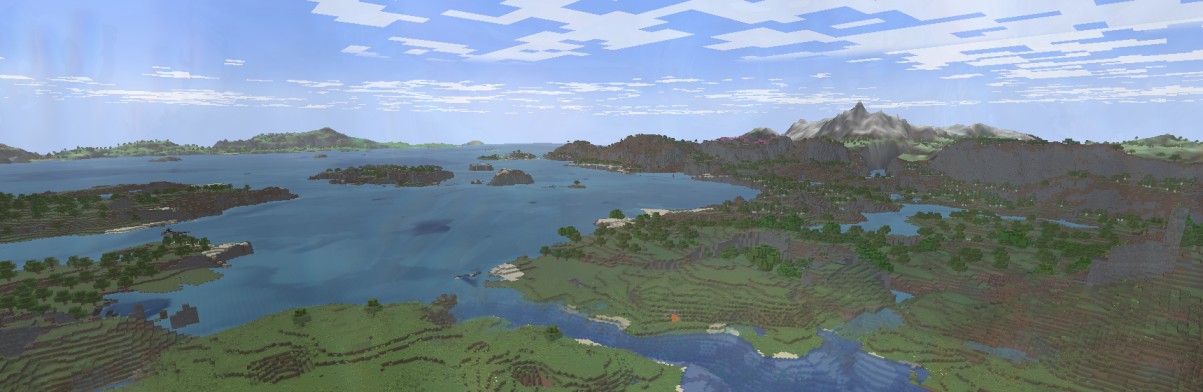 A beautiful view going far into the ocean, allowing you to see mountains and islands far away
