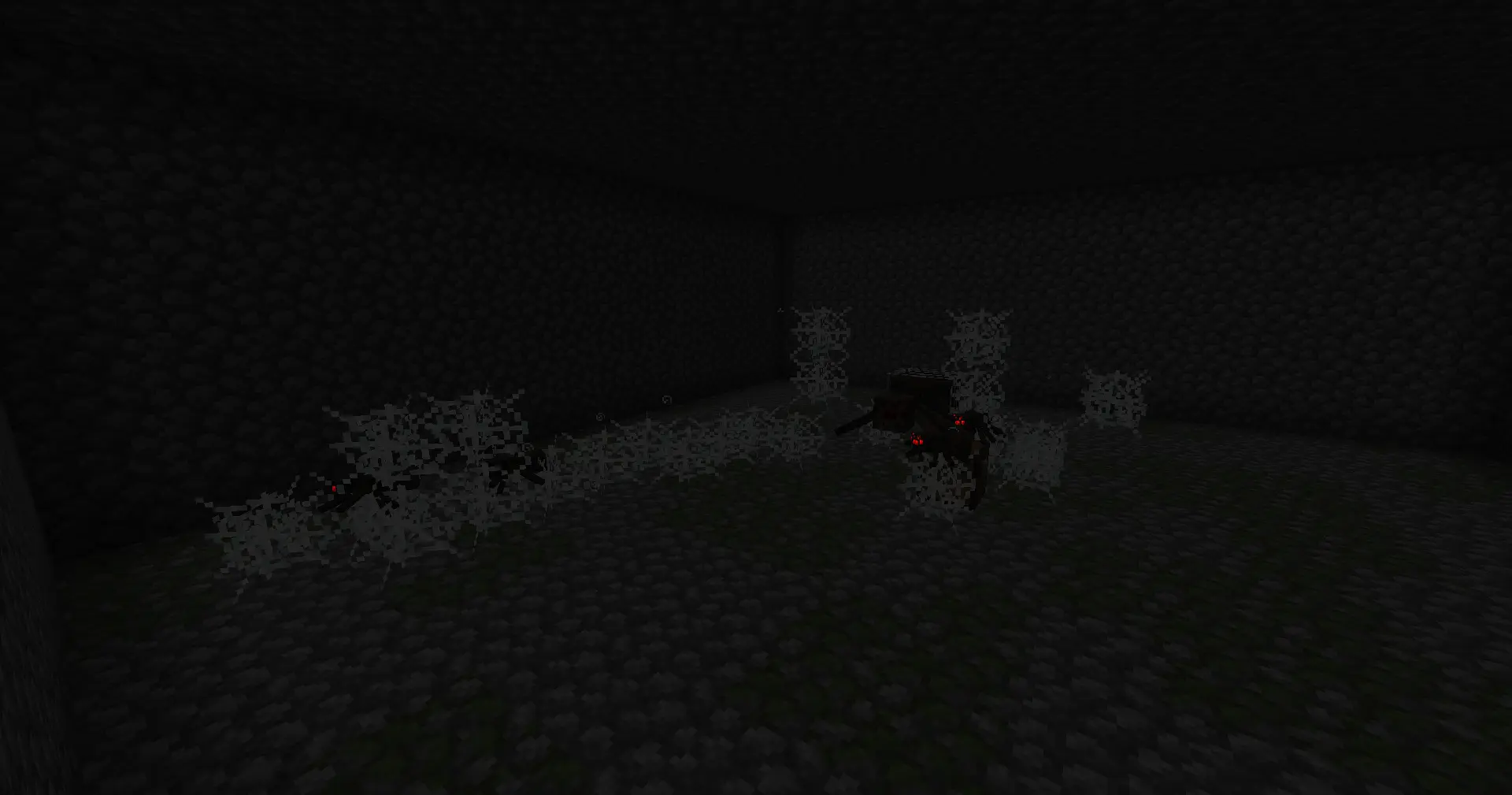 Matriarch and other smaller spiders in a monster room