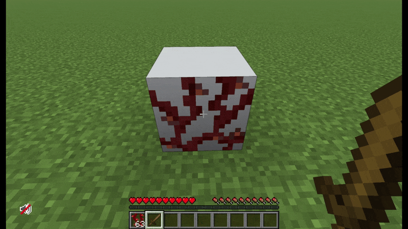 Player scrapes weeping vines off the side of a block, removing the texture from the block.