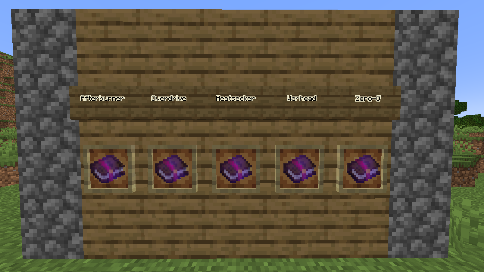 All five custom enchantments displayed on item frames: Afterburner, Overdrive, Heatseeker, Warhead and Zero-G