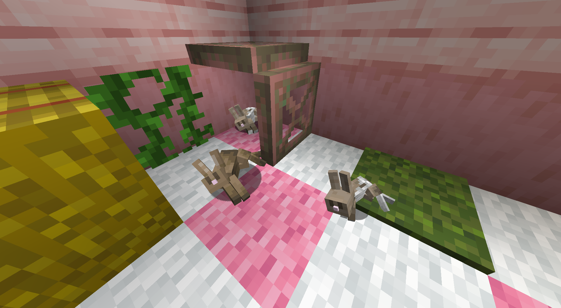 2 adult and 1 baby rabbit flopping on their side in the corner of a pink Minecraft house