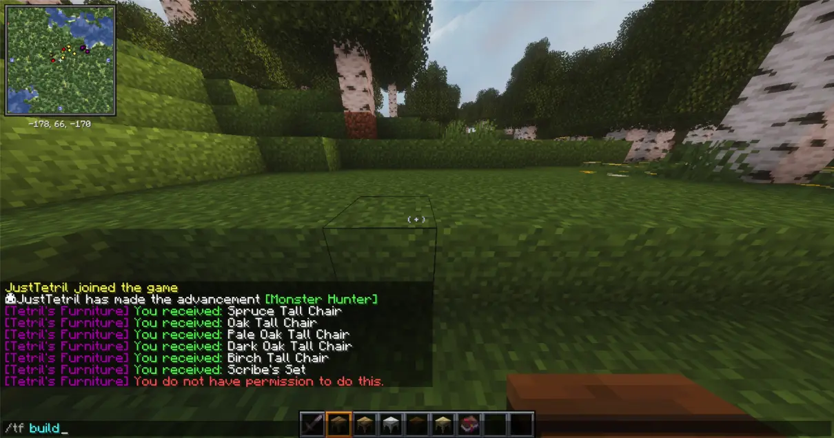 This Minecraft screenshot illustrates the command-line interface being used to toggle the plugin's "build mode." The player is standing in a grassy forest clearing during the day, with birch trees and hills visible in the background.