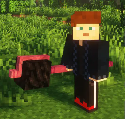 A player (me) holding a coal block staff