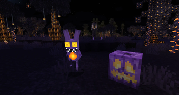 A Spooky Troll Next To A Ghoulish Gourd