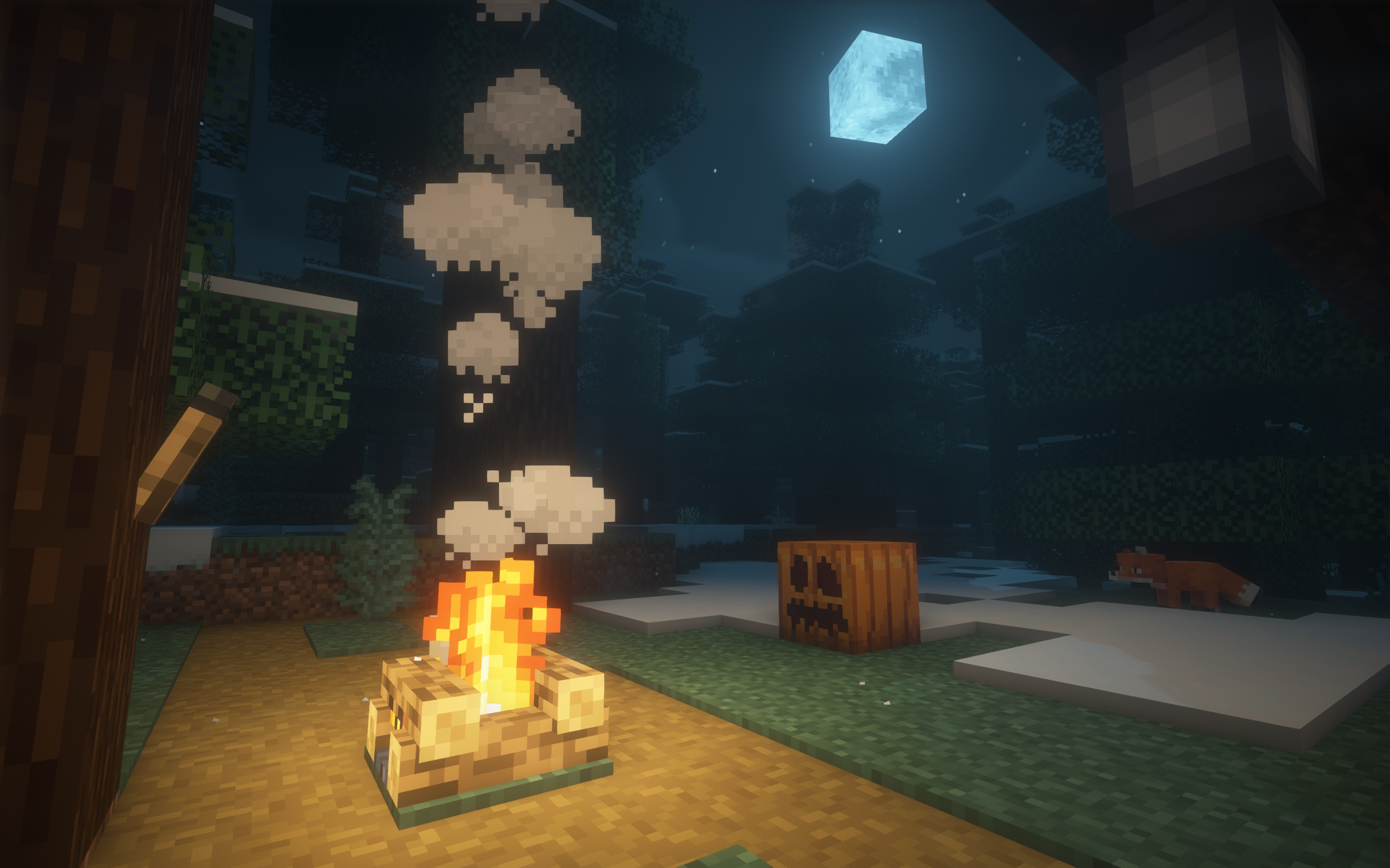A campfire burns in the dark night, moonlight shining past the canopy of the treetops. An unlit torch, lantern, and jack o'lantern reside close by. Villagers were likely celebrating Halloween ...