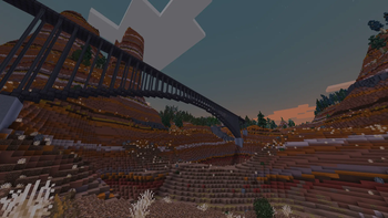 A rail bridge over red rocks. 