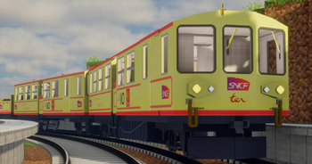 Train jaune on curved platform