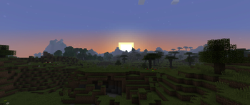 Sun setting over a savanna