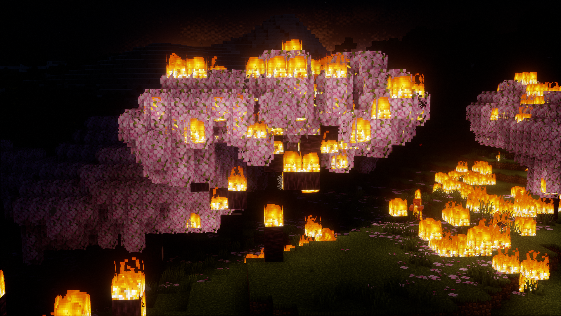 A cherry tree in minecraft burning at night with other cherry trees around it also burning.