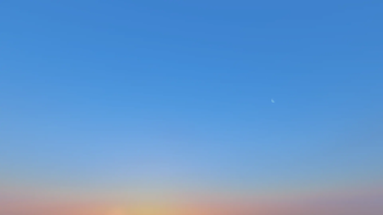 Waning cresent on sunrise summer
