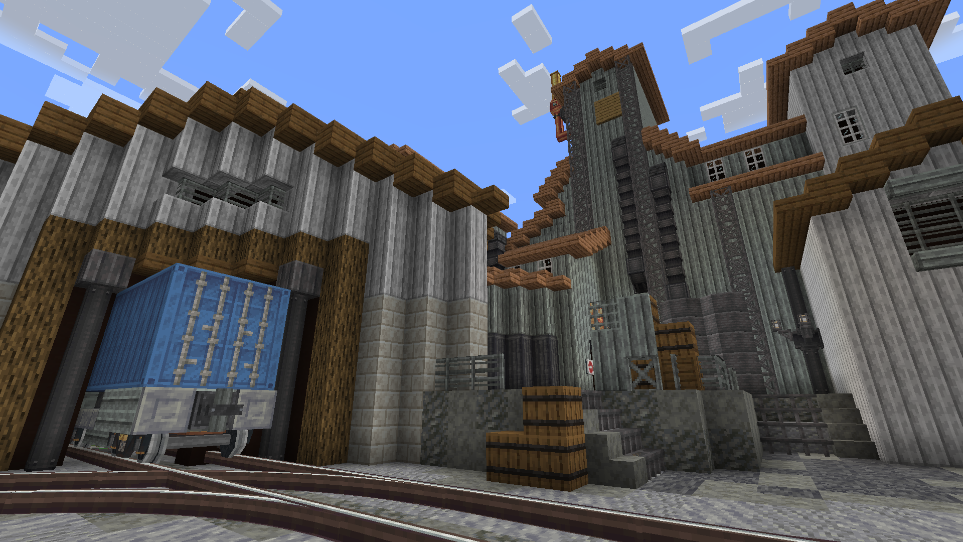 A number of industrial buildings made from blocks from this mod