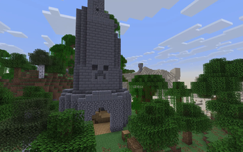 Tower with a statue on the background