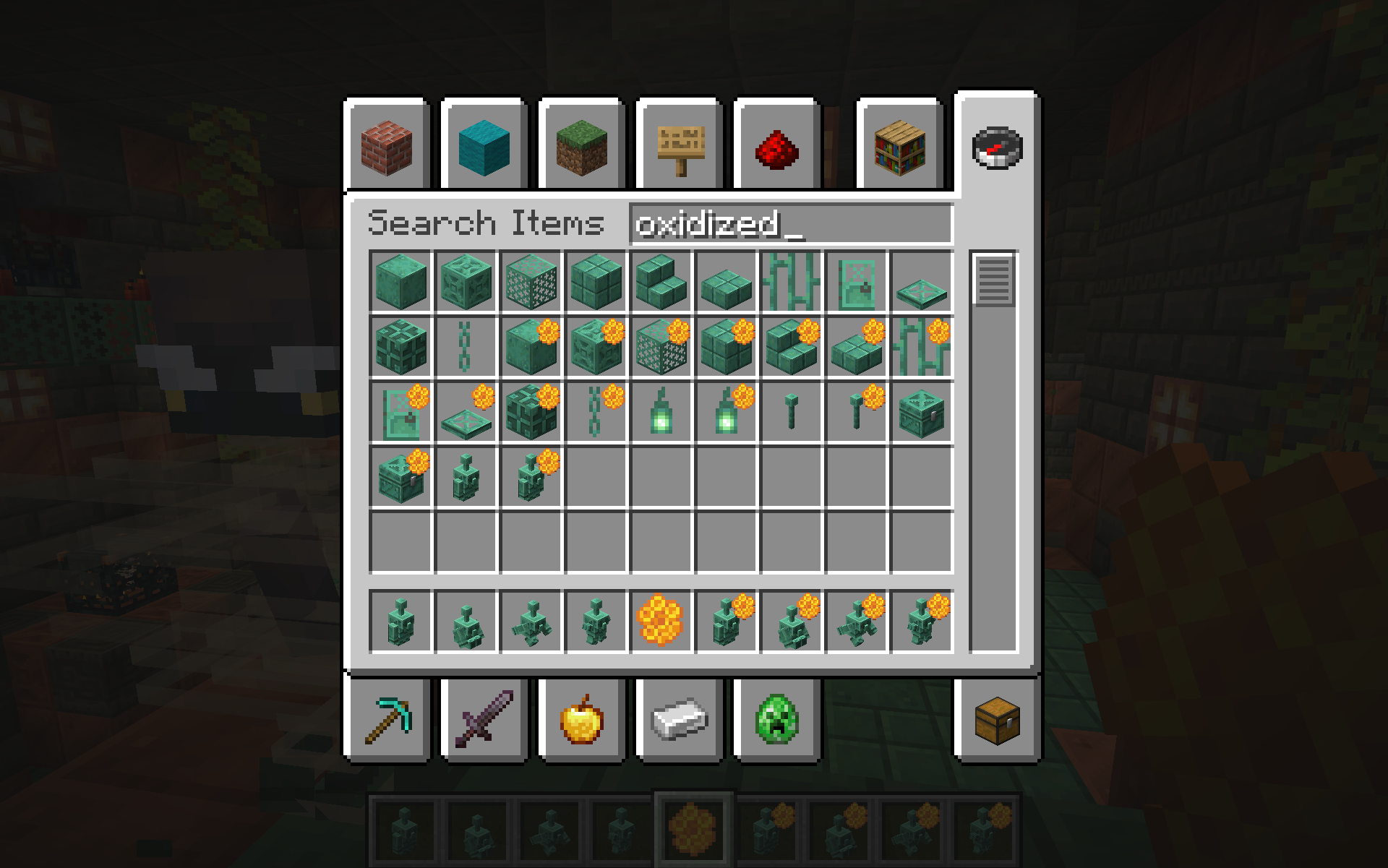 A Minecraft inventory menu screen inside a Trial Chamber, showing a grid of various oxidized copper items and blocks. Several of the oxidized copper block icons in the menu feature a small, distinctive orange honeycomb badge in their top-right corner, indicating that they are the waxed versions of the items.