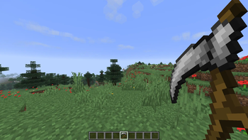 scythe held in hand