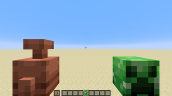 Copper golem and creeper spawn egg in both hands