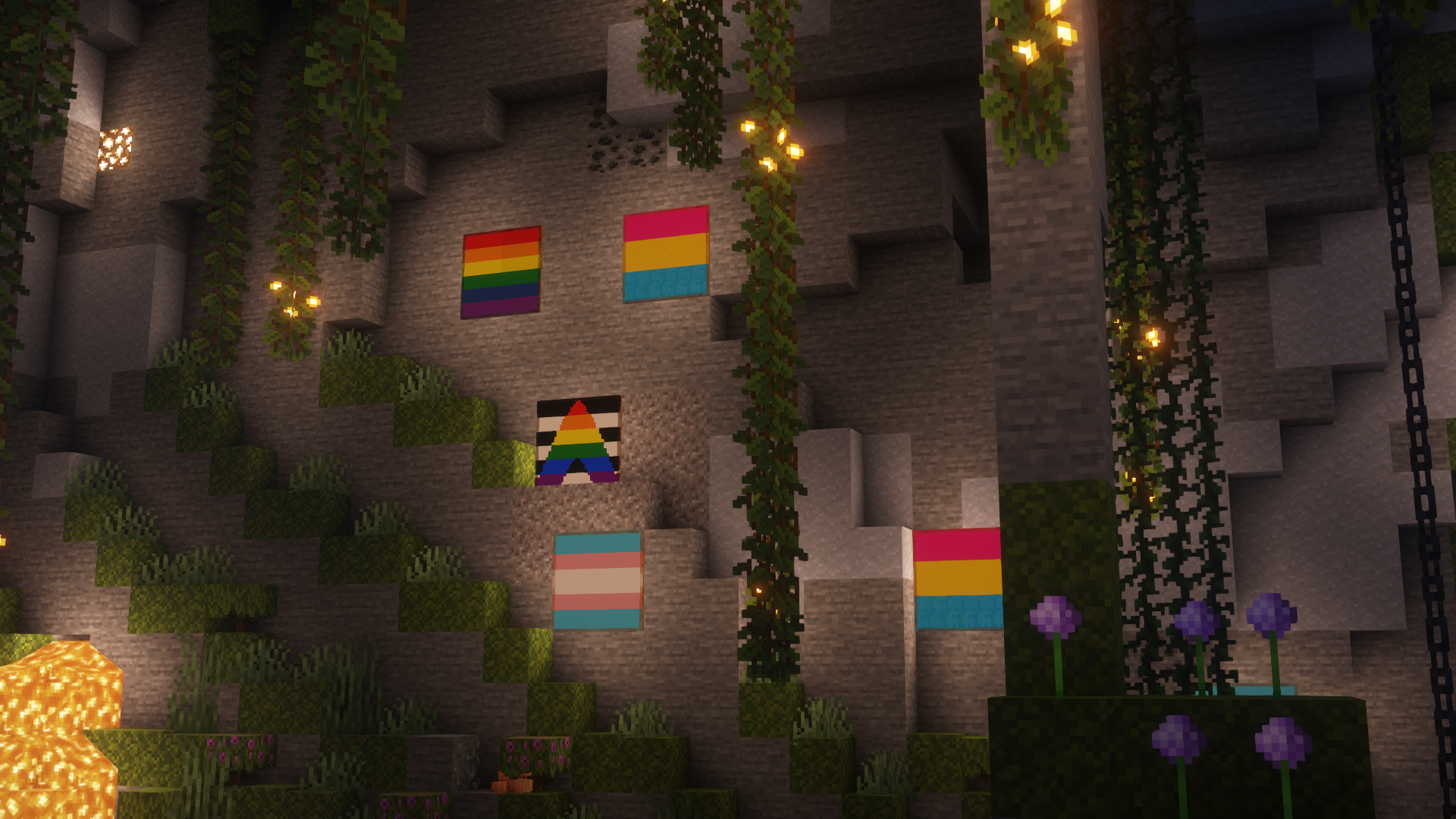 Six pride flag themed paitings on the walls of a Lush Cave