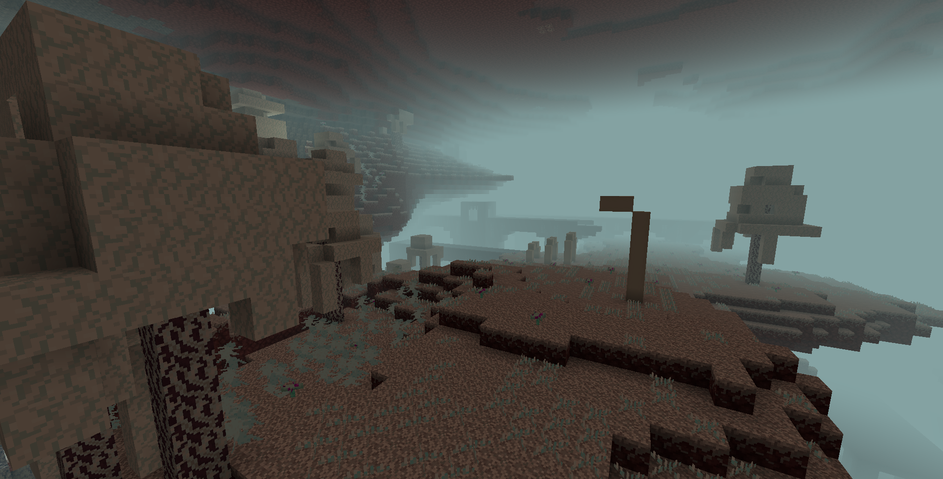 An image showing the frosted nether biomes. On the left, a small frosted forest can be seen, while the rest of the image is of large frosted wastes. Some fossils and a lone giant frosted fungus can be seen in the frosted wastes, and a Nether fortress is visible in the background.