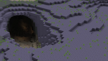 A cave surrounded by lush blue terracotta.