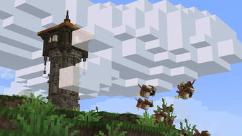 Sparrows flying near a tower.
